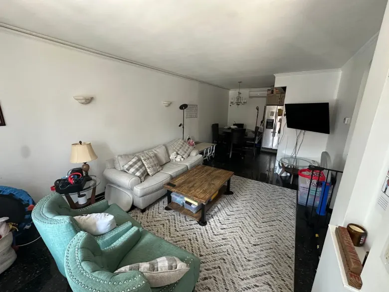 Lived-in room with visible clutter before AI decluttering