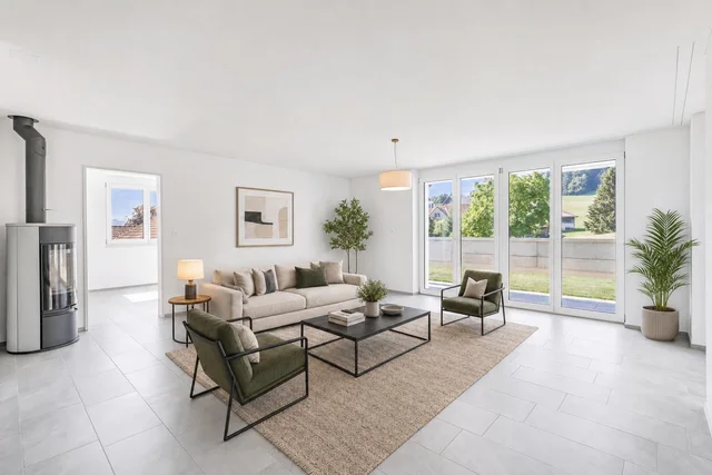 Modern living room with beige sofa, two olive green armchairs, black coffee table on beige rug, large windows, and gray tiled floor.