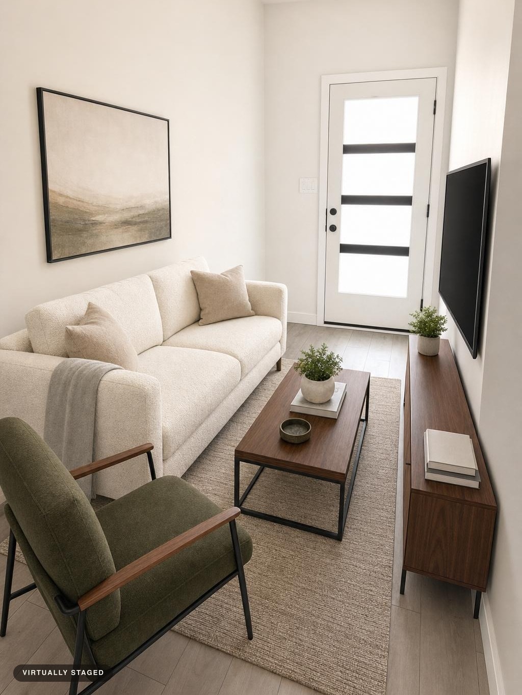 Modern living room with cream sofa, olive armchair, wooden coffee table and console, and textured beige rug.