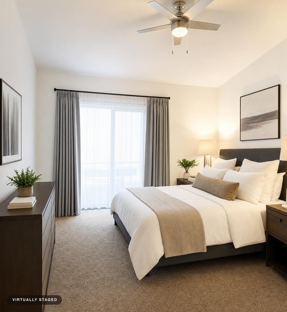 Modern bedroom with a gray bed, neutral linens, wood-tone dresser and nightstand, gray curtains, and white walls.