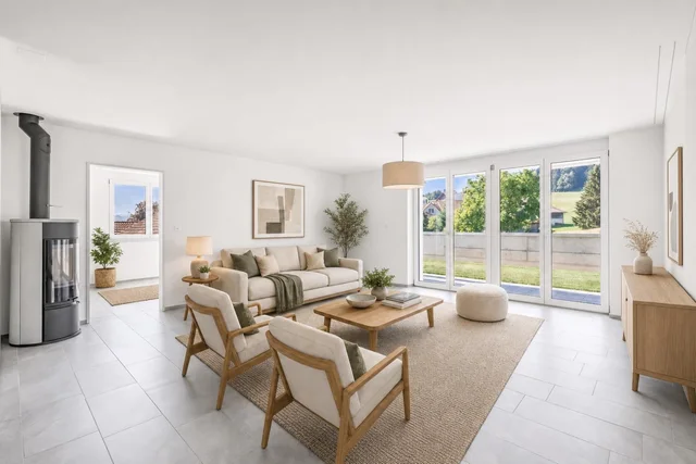 Spacious Scandinavian living room with beige sofa, two armchairs, wooden coffee table, large windows, and minimalist decor.